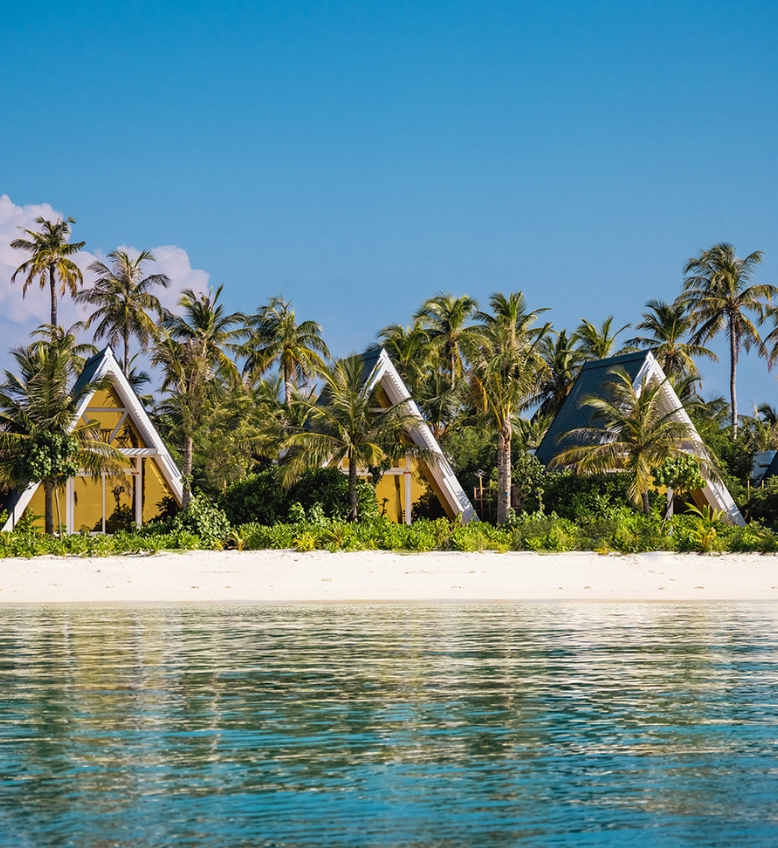 Stunning beachfront Maldives resorts with a clear blue sky